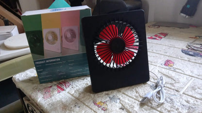 Side profile of the USB powered portable desk fan, demonstrating its small footprint on a desk.