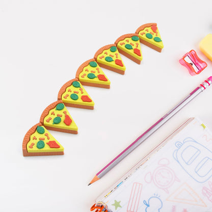 A set of seven colorful 3D pizza slice erasers arranged on a clean white surface.