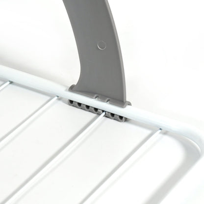 Folding drying rack neatly collapsed for compact storage under furniture or in a drawer.