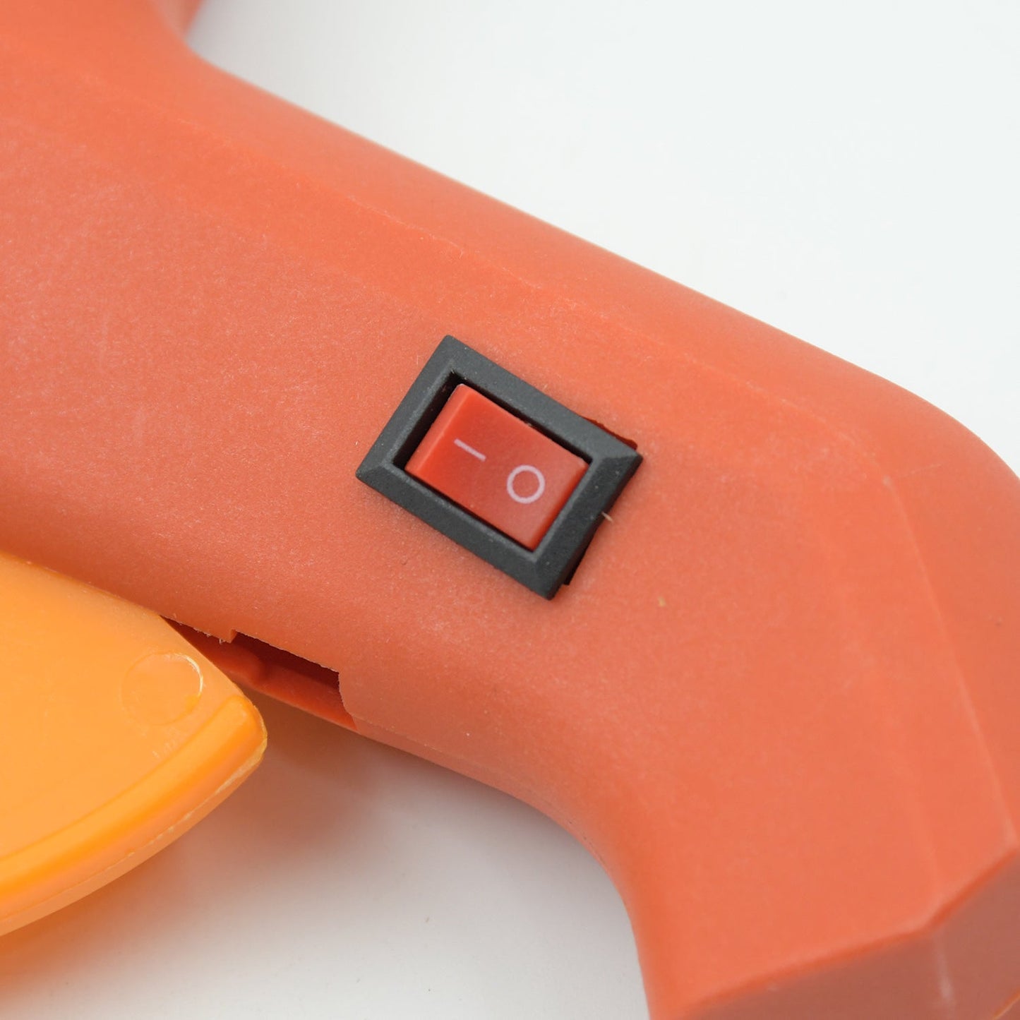 The 60-watt hot melt glue gun displayed with its included glue sticks, ready for various DIY tasks.