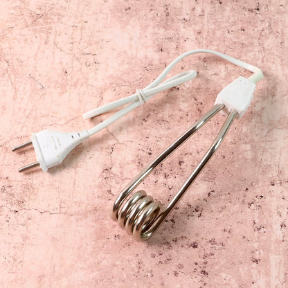 Portable immersion heater rod showing its compact design for travel