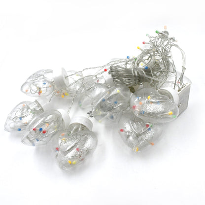 Bright LED wish ball lights creating a warm ambiance for an indoor celebration.