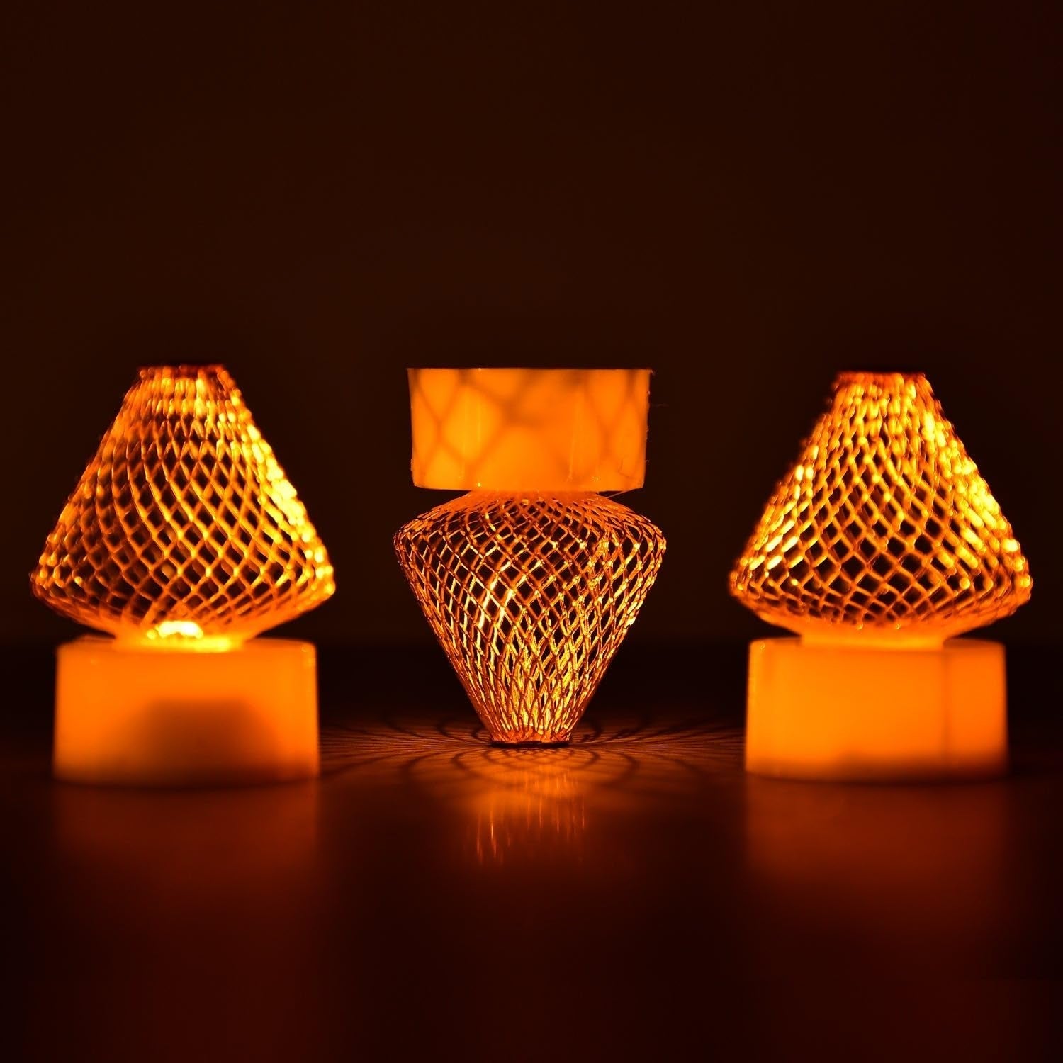 Battery-operated LED flameless candle lights in a set of four