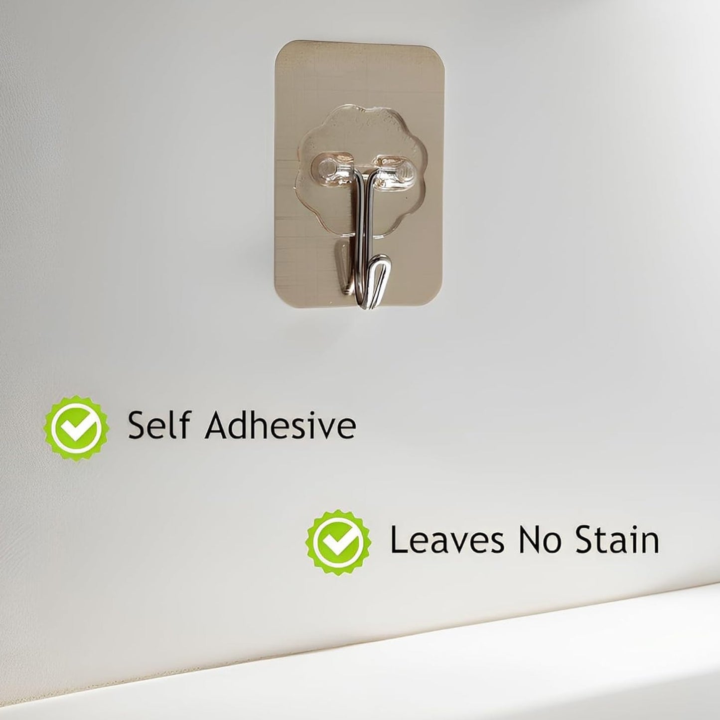 Close-up of reusable transparent wall hook adhesive for utility hanging