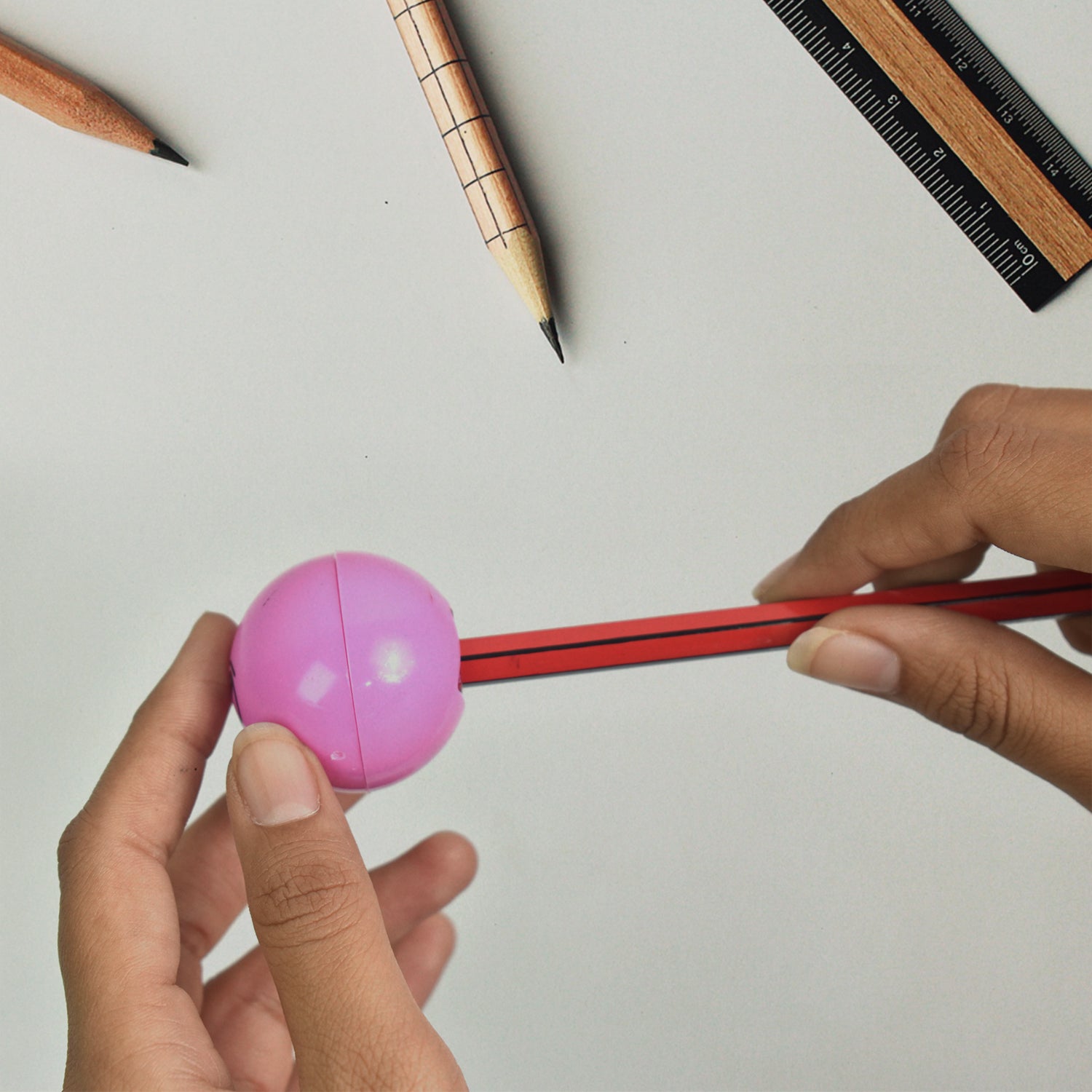 Detailed view of a compact, colorful round kids pencil sharpener.