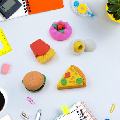 A child's hand holding a mini food-shaped eraser, showcasing its small size and detailed design.