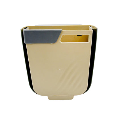 The foldable hanging trash can shown in a kitchen setting, attached to a cabinet.