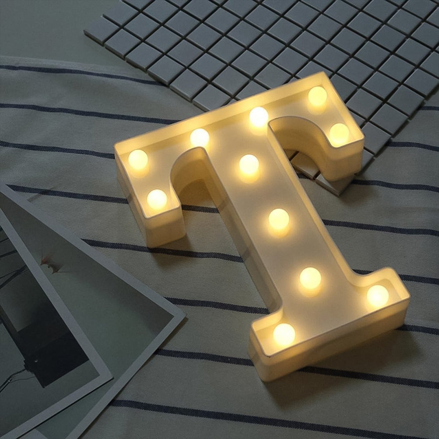 Decorative light with LED bulbs in marquee letter T design