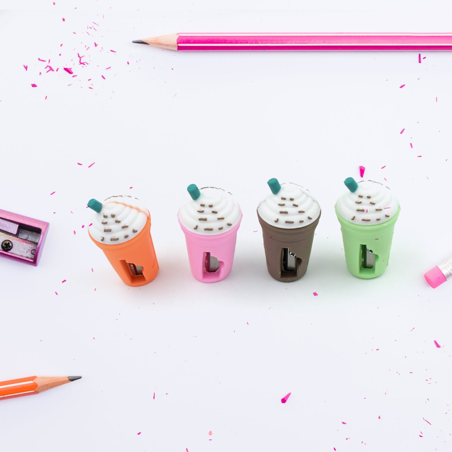 A hand holding the coffee-shaped pencil sharpener, ready for use.