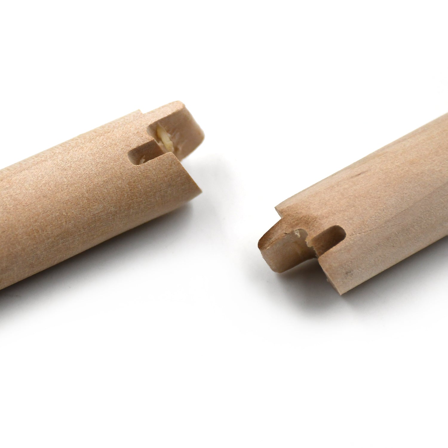 Multiple durable wooden hangers neatly stacked, ready for use.