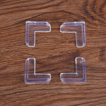 Flexible clear silicone corner guard on a furniture edge, showcasing its protective design.