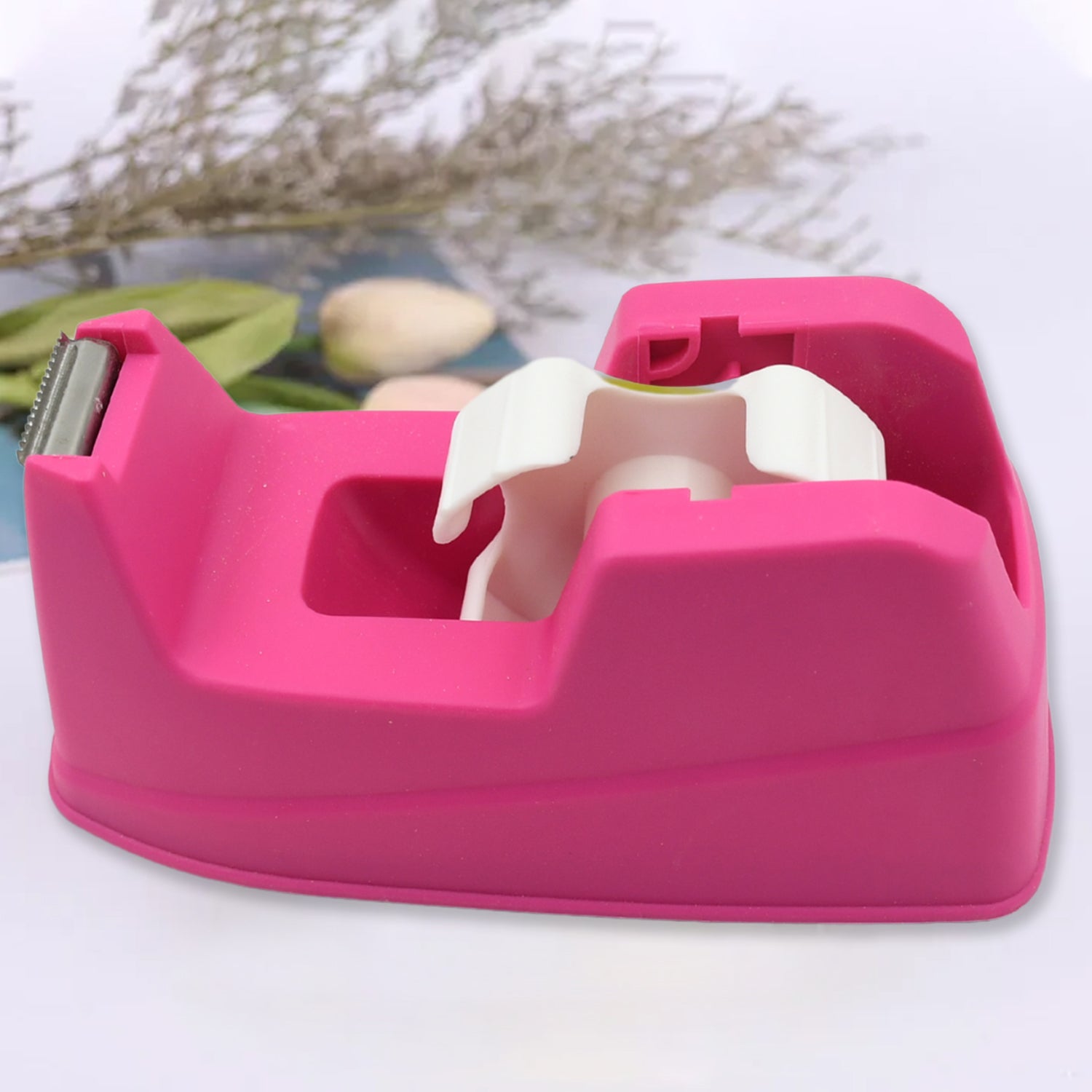 Close-up of the sharp, corrosion-resistant blade on the plastic tape cutter.