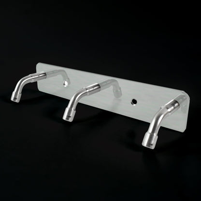 Stainless steel coat hook rack holding towels and bags