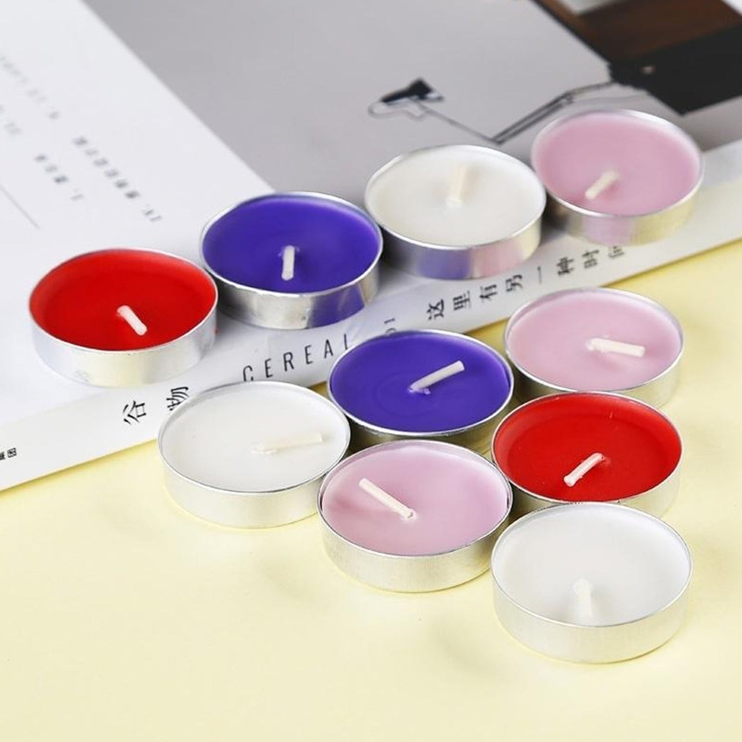 Vibrant decorative tealight candles, 50-piece set, perfect for festive ambiance.