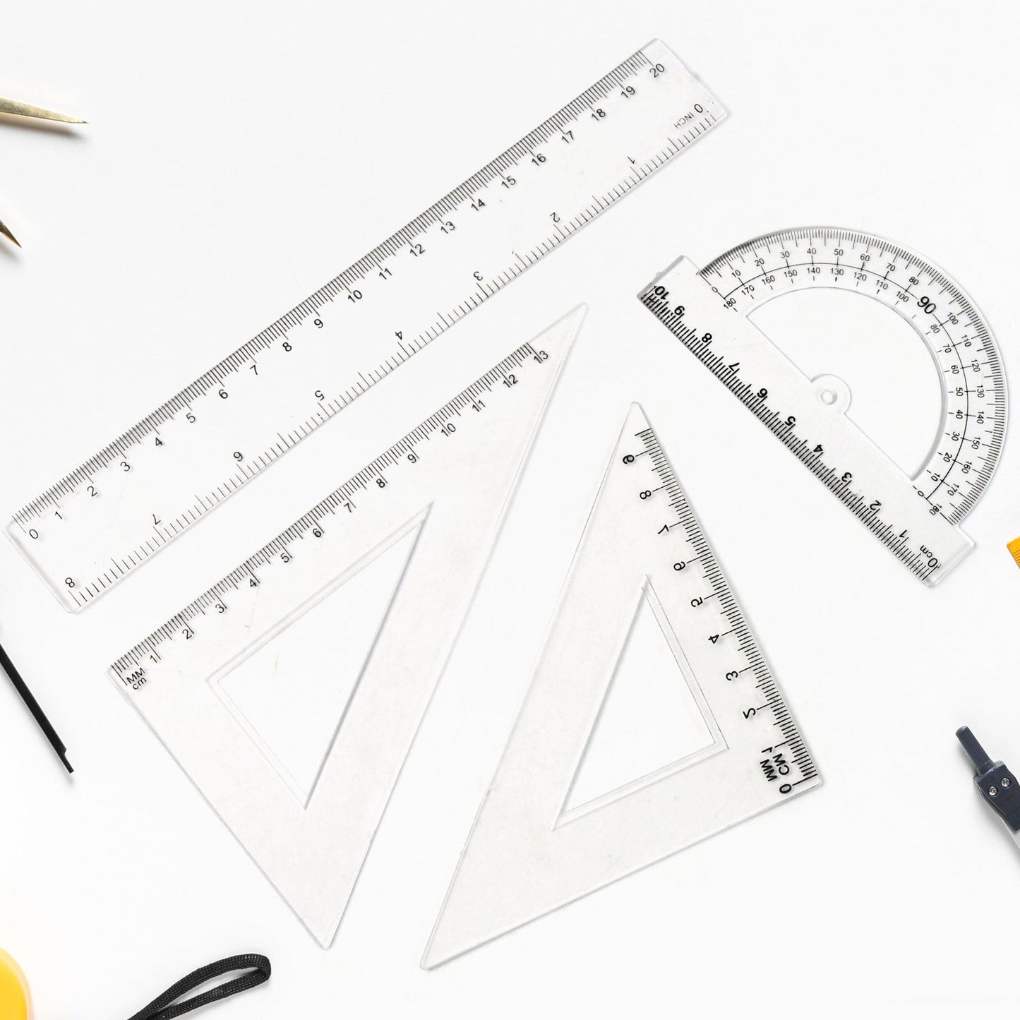 Clear plastic 4-piece geometry set including triangle ruler and protractor with precise measurements