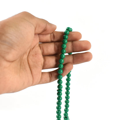 Detailed view of the tasbih beads and small bag, perfect for spiritual reflection during Umrah.