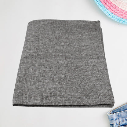 Decorative throw pillow covers with intricate patterns on a bed.