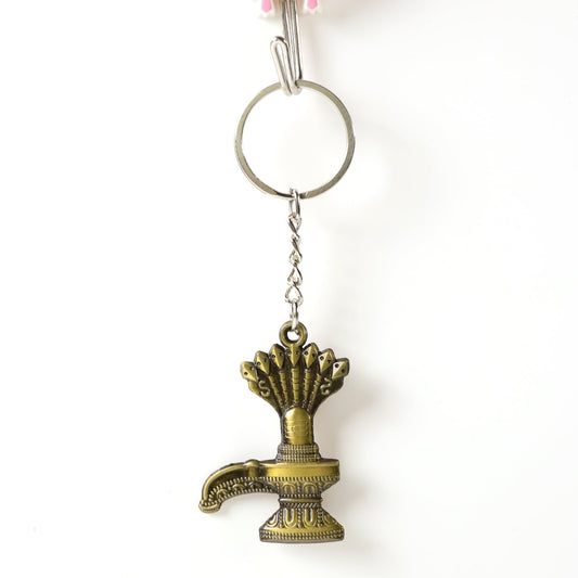 Close-up of Lord Shiva Shivaling metal keychain with detailed serpent design