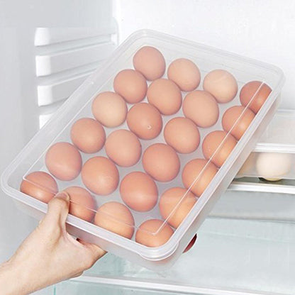 Hand pulling out a clear 24-grid plastic egg container from fridge shelf