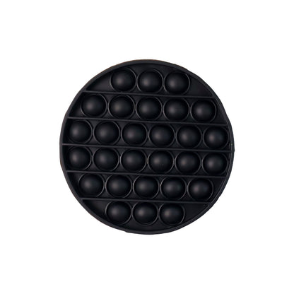 Side view of round silicone Pop It fidget toy for sensory fun