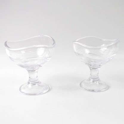 Clear glass dessert bowl highlighting its sturdy footed base.