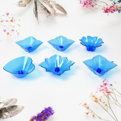 The elegant plastic candle holders from the Diwali Diya Set displayed on a surface.