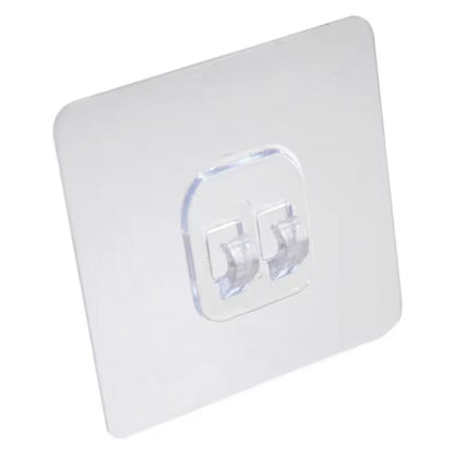 Self-adhesive wall hook holding a towel neatly in a modern bathroom.