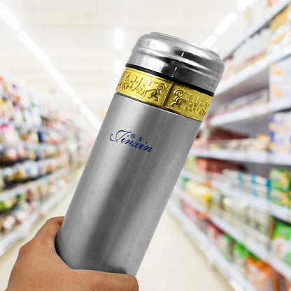Side view of the reusable stainless steel water bottle, showcasing its ergonomic design and compact size.