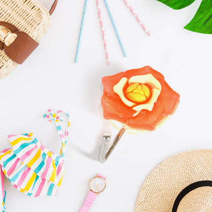 A collection of unique design self adhesive wall hooks displayed together.