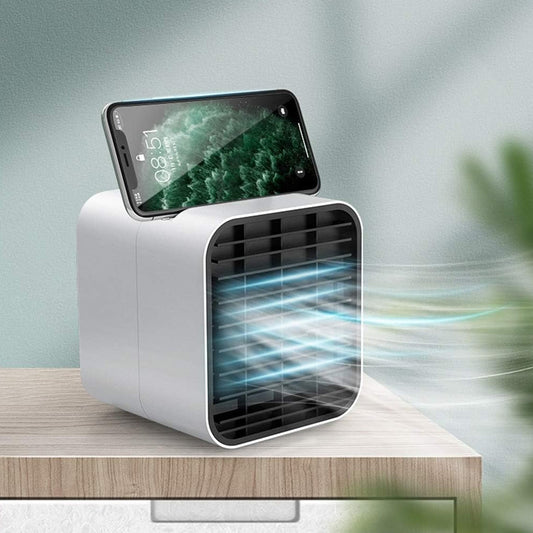 Pink portable mini air cooler fan with water cooling function on desk