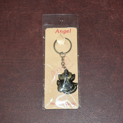 Ganesh Face Antique Black Metal Keychain placed on plain background for clear visibility