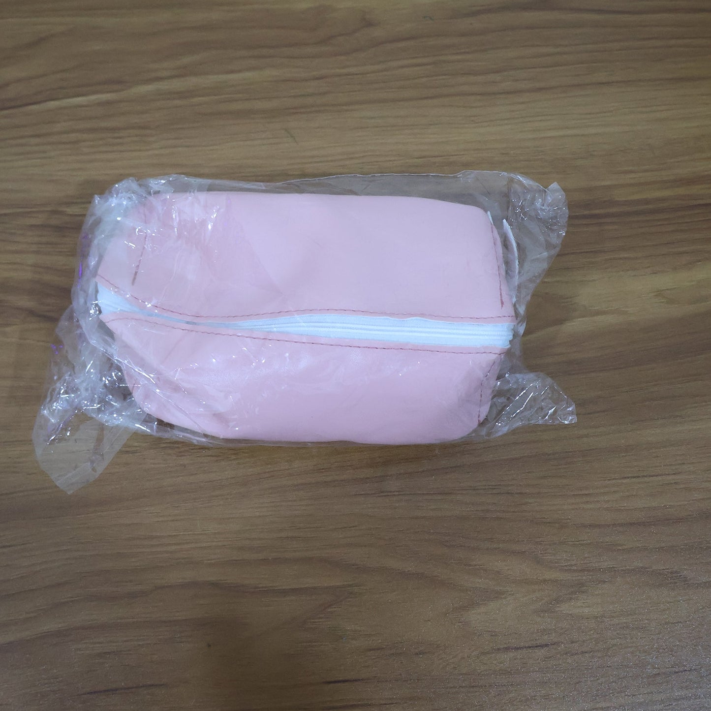 Multiple PU leather cosmetic & pencil pouches in various colours for versatile use.