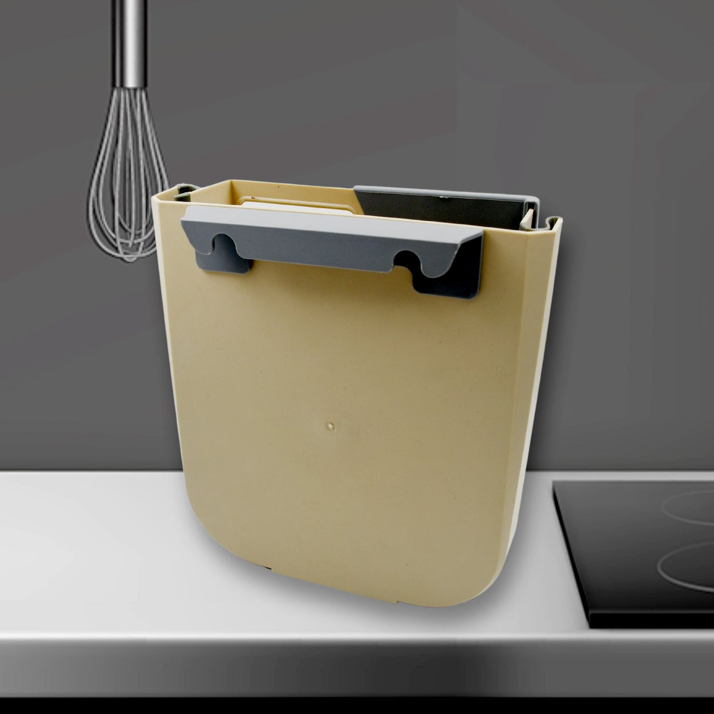 A detailed view of the simple installation of the kitchen cabinet dustbin on a door.