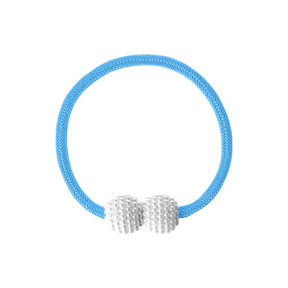 Detailed view of braided polyester rope and strong magnet on curtain tieback