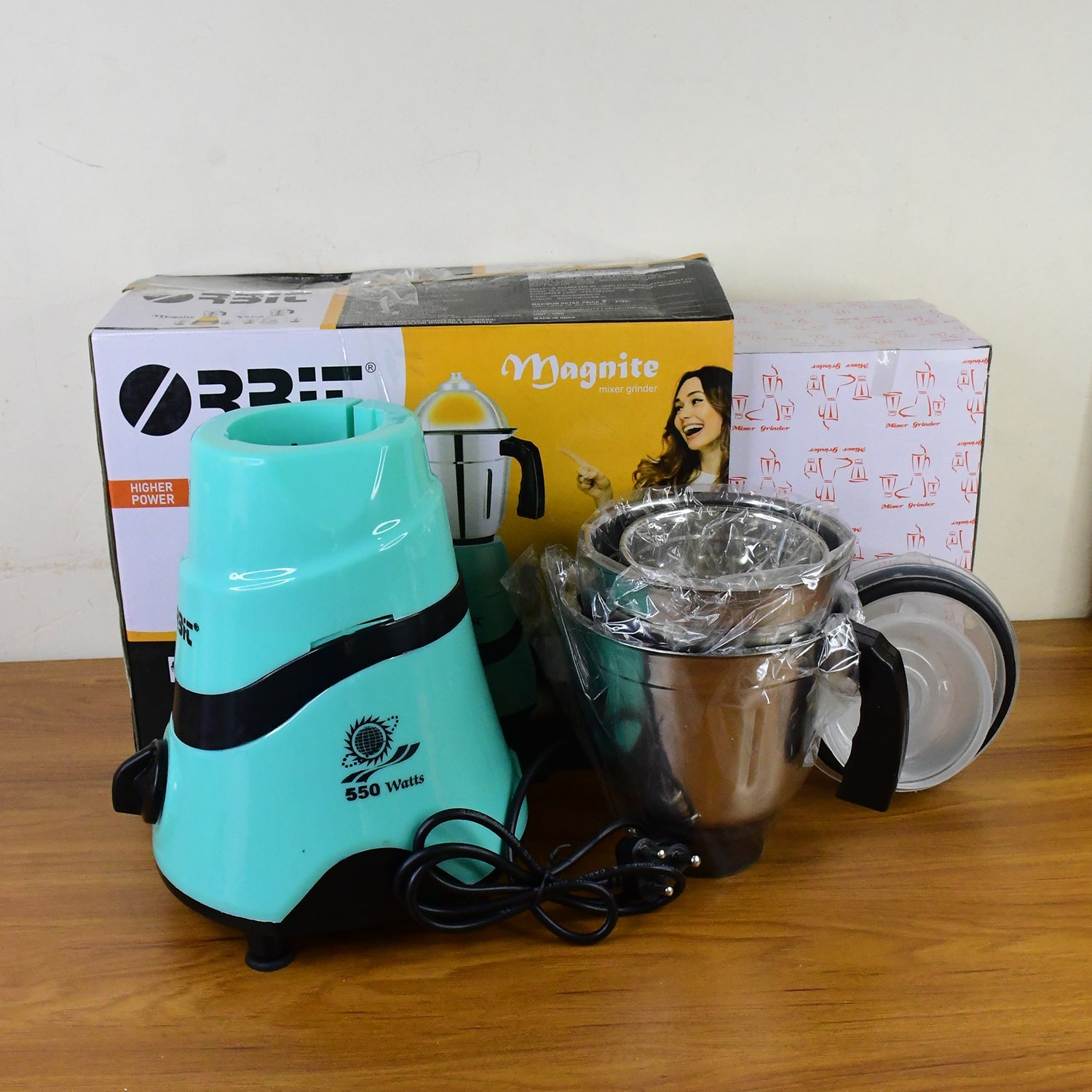 Orbit mixer grinder accessories including 3 stainless steel jars and lids.