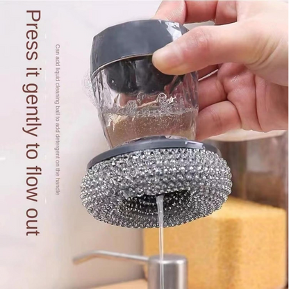 Close-up of the soap dispenser with scrub button, showing soap being dispensed onto a sponge.