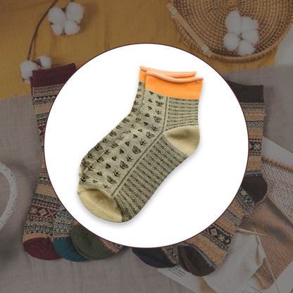 Pair of grey women's ankle socks, showcasing soft texture and comfortable fit.