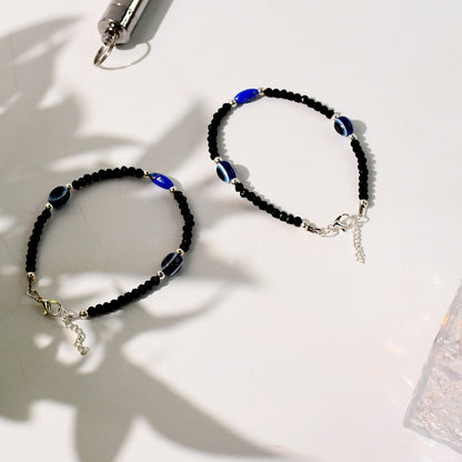 Unisex adjustable black evil eye bracelet set with silver accents
