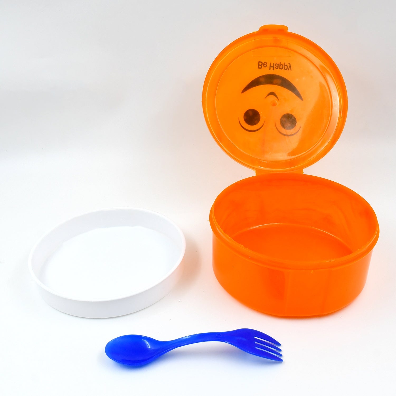 Side angle of the round lunch box with spoon, perfect for small hands.