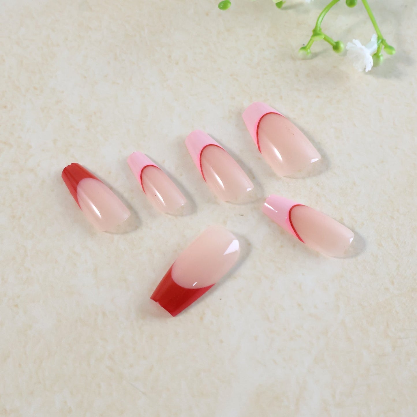 Artificial nails in natural nude shade with glossy acrylic finish