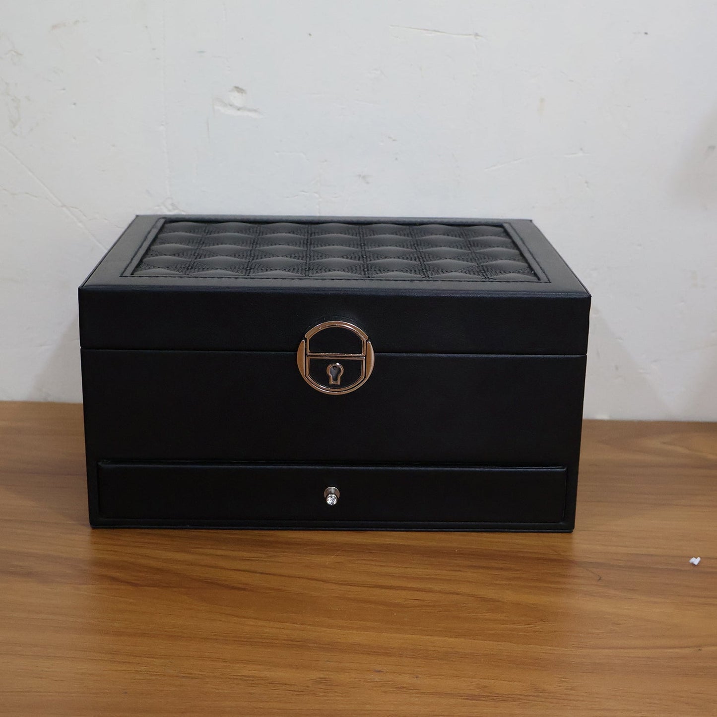 Close-up of the lockable clasp on the elegant multi-layer jewellery storage box.