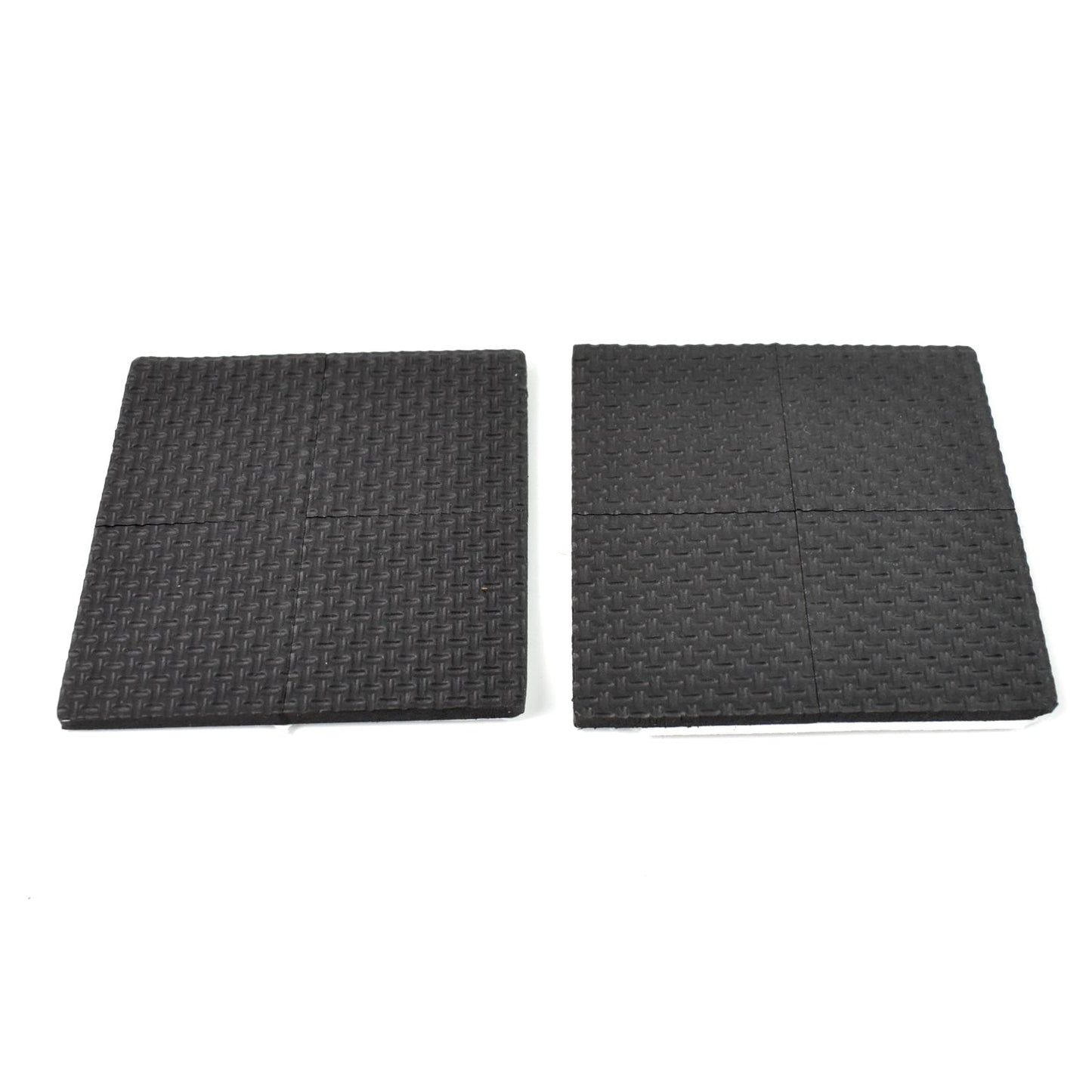 Four round felt pads applied under the legs of a wooden chair on a dark floor.