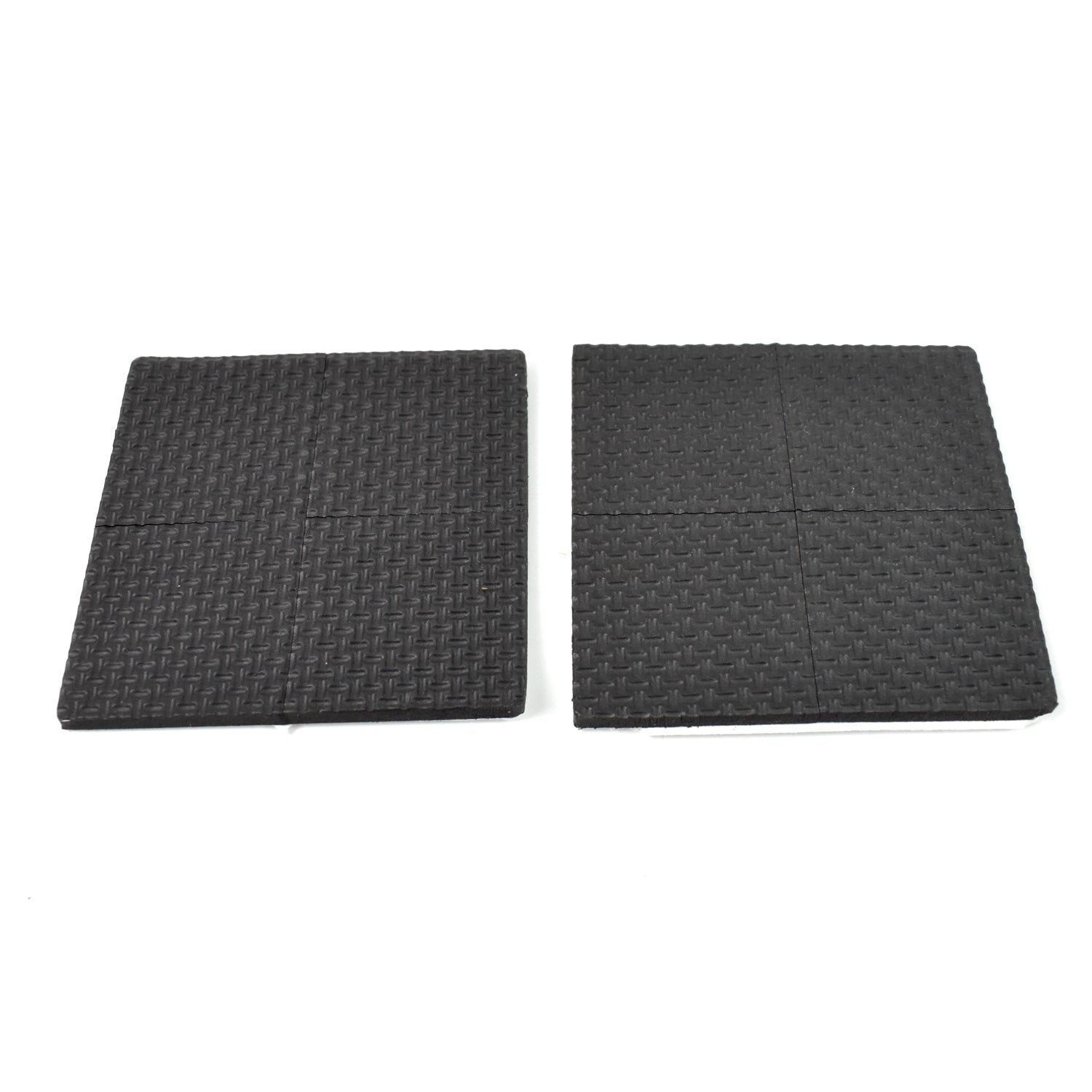 Four round felt pads applied under the legs of a wooden chair on a dark floor.