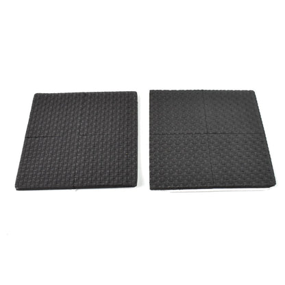 Four round felt pads applied under the legs of a wooden chair on a dark floor.