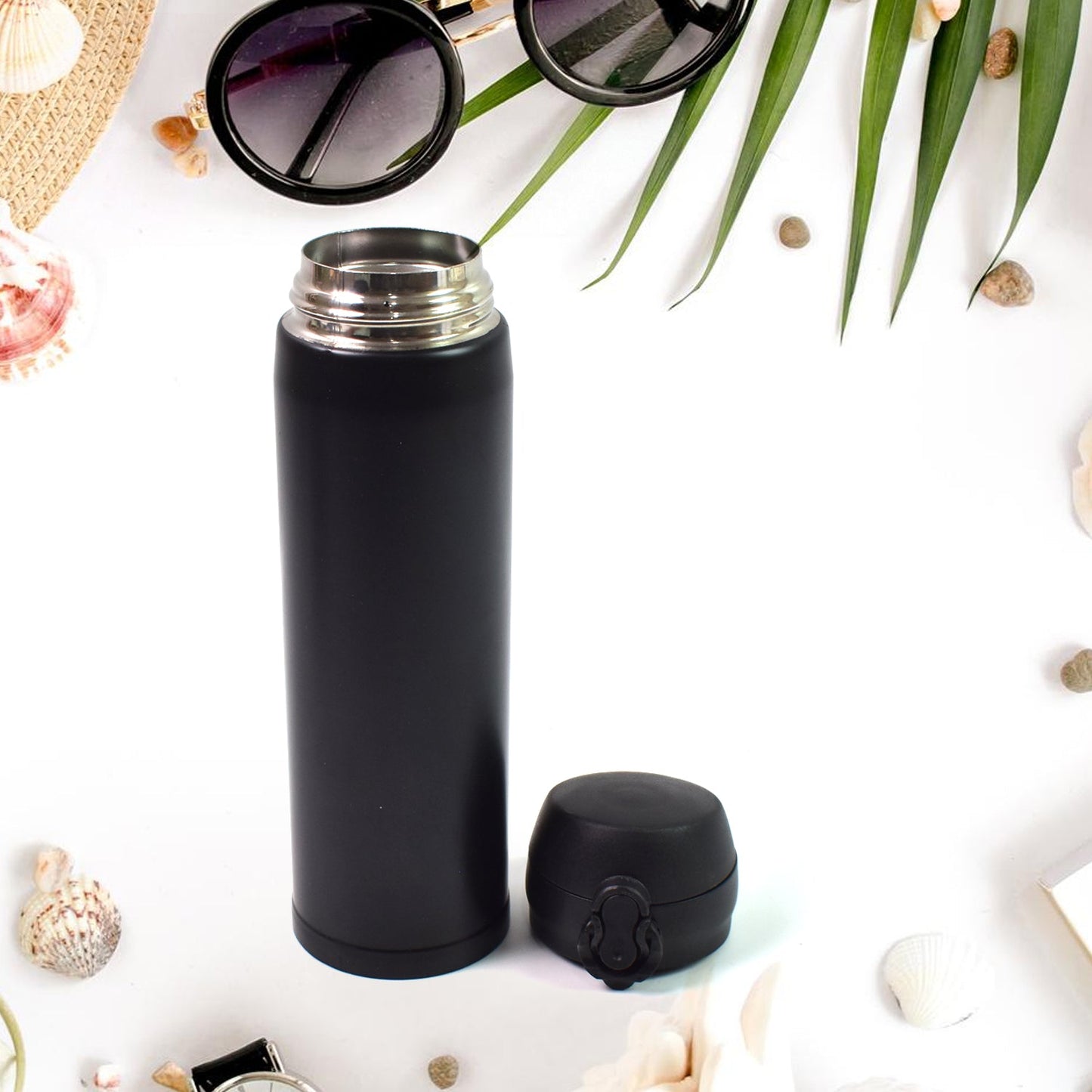 Child holding a vibrant 500ml kids insulated water bottle, perfect for school.
