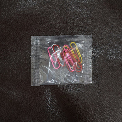 Colourful vinyl-coated paper clips securely holding important files and documents together.