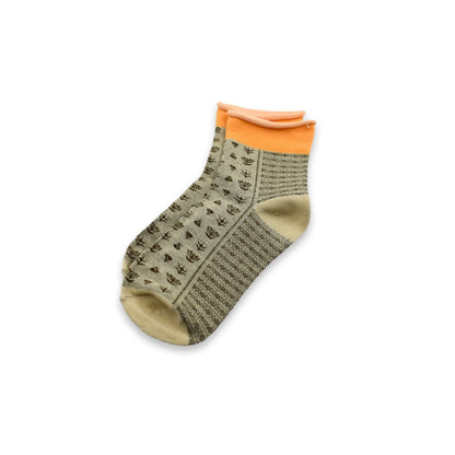 Stacked grey ankle socks, ready for comfortable daily wear.