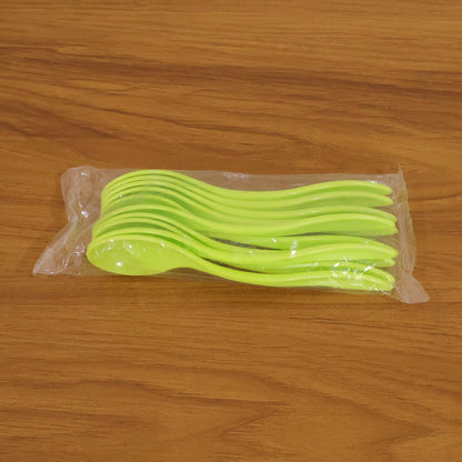 Collection of white plastic spoons arranged neatly, ready for use at any meal.