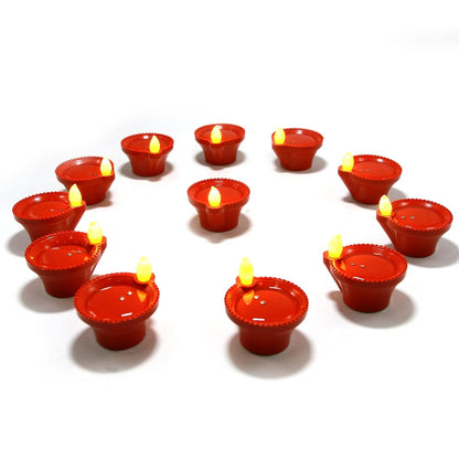 A single water sensor diya glowing with a warm, flickering LED light.
