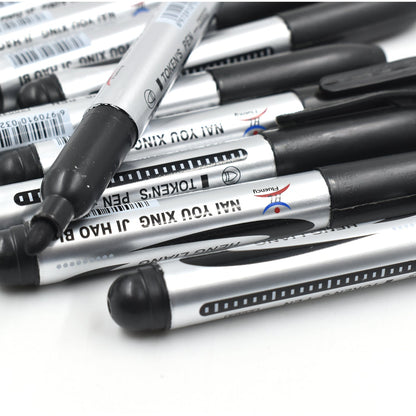 Hand holding an InkGlow Permanent Black Marker for smooth writing.